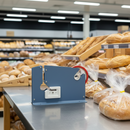 Plastic bag neck sealer next to sealed bread bags 